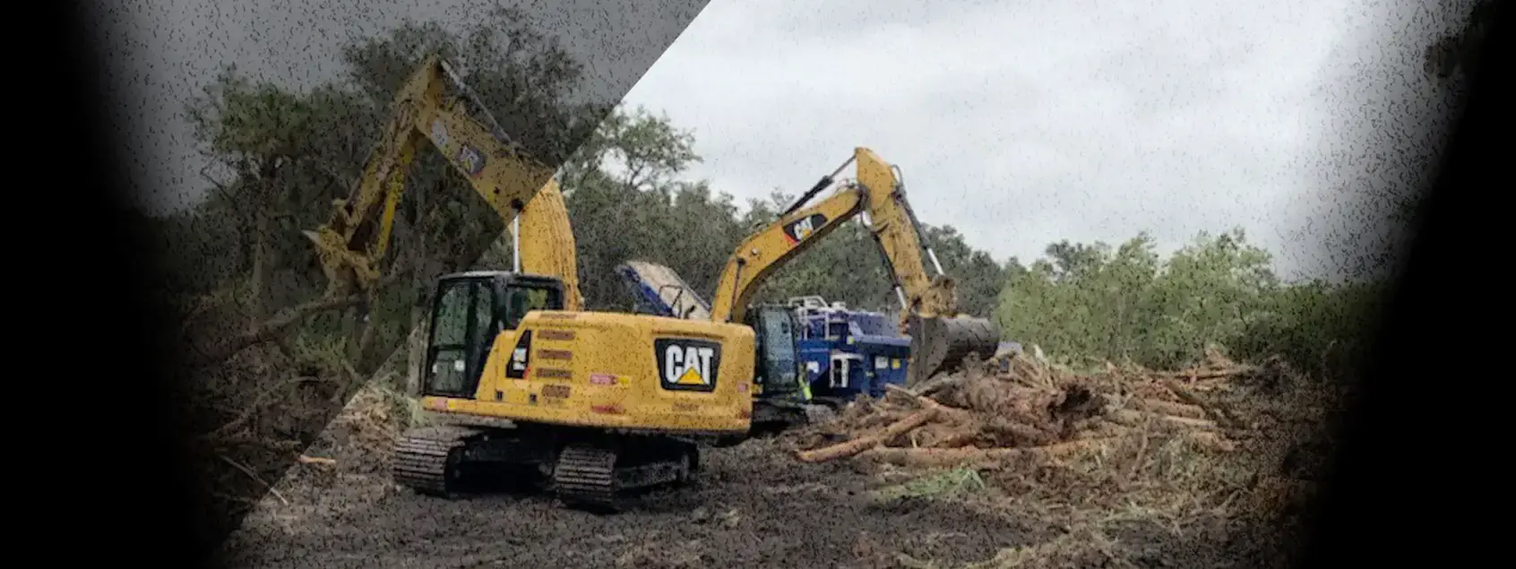 Ongrade excavators clearing trees on a construction site